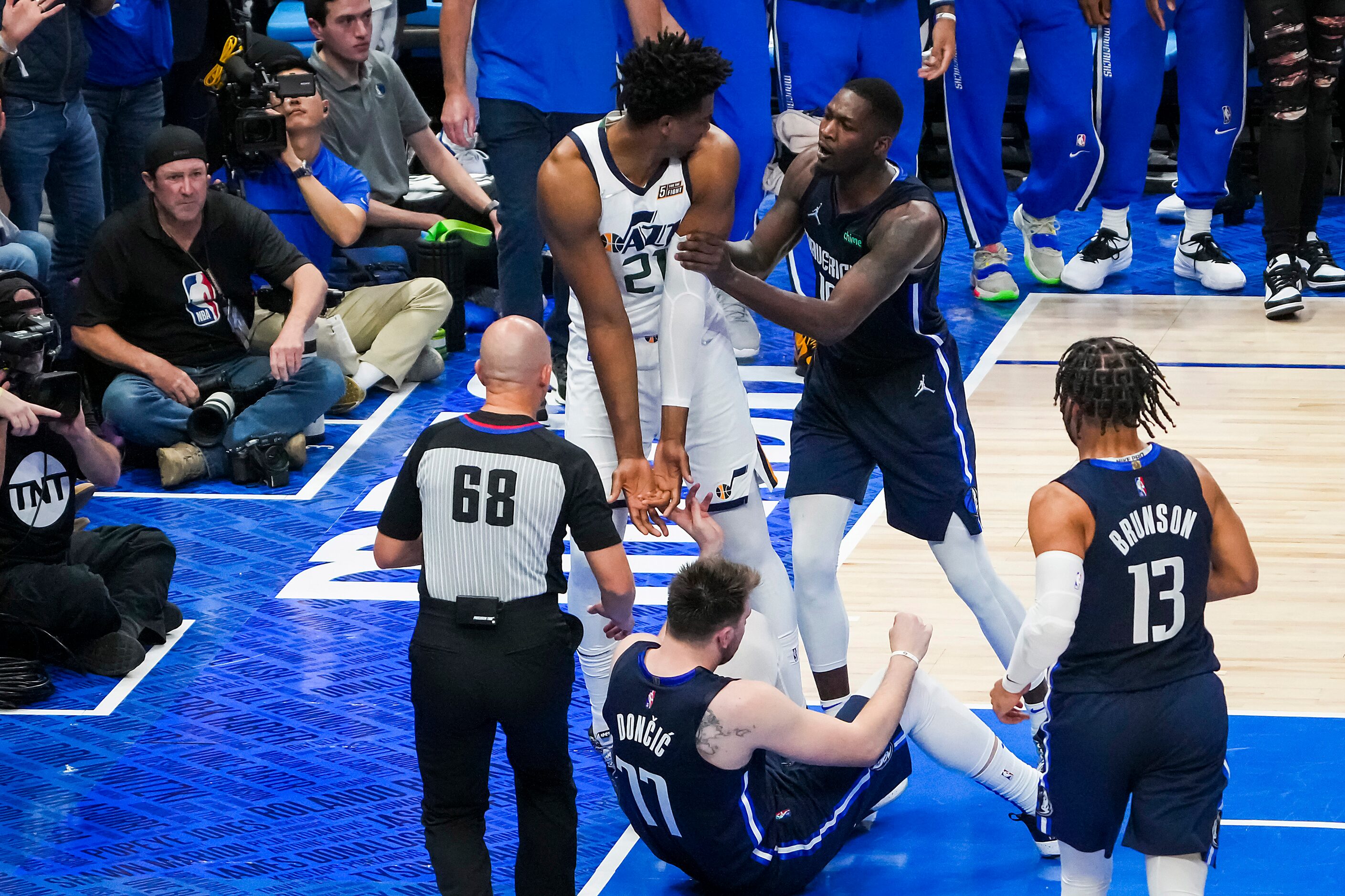 Dallas Mavericks forward Dorian Finney-Smith (10) shoves Utah Jazz center Hassan Whiteside...