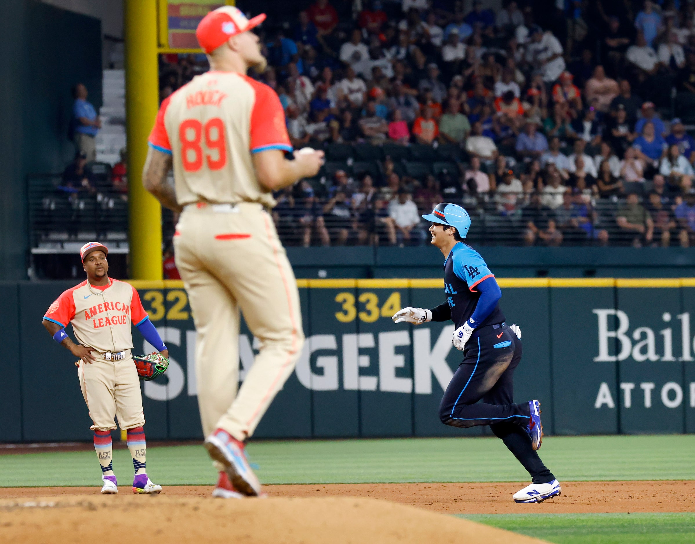 National League's Shohei Ohtani, of the Los Angeles Dodgers, rounds the bases after hitting...