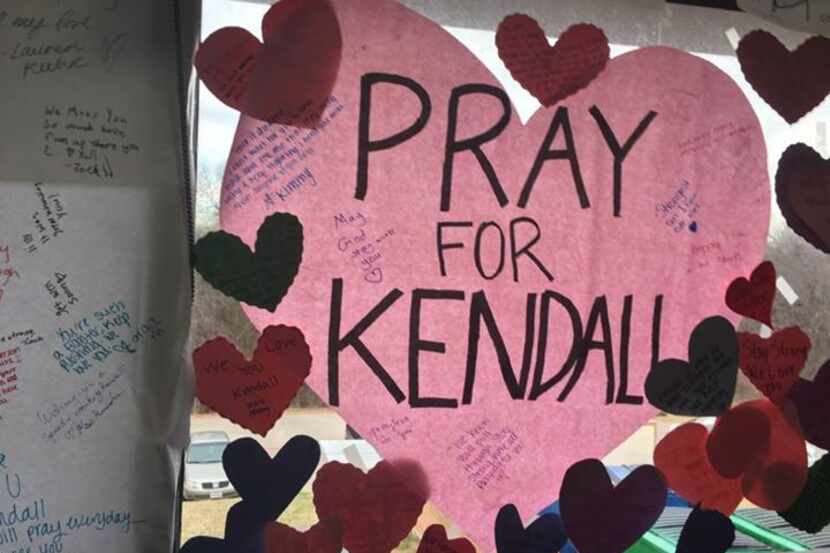Signs hang for Kendall Murray who is recovering from a crash that killed two of her friends.