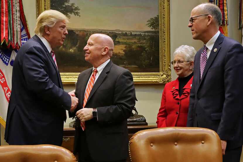 President Donald Trump greets House Ways and Means Chairman Kevin Brady, with Education and...