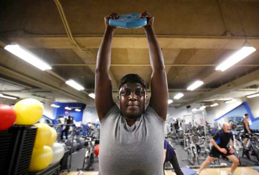 
LaWanda Williams works out with other city employees at the Dallas City Hall Fitness...