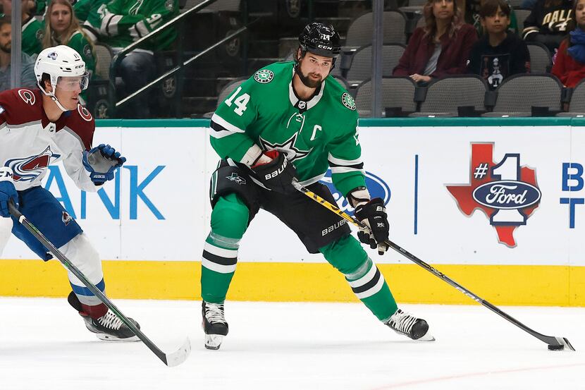 Dallas Stars left wing Jamie Benn (14) looks to pass against Colorado Avalanche left wing...