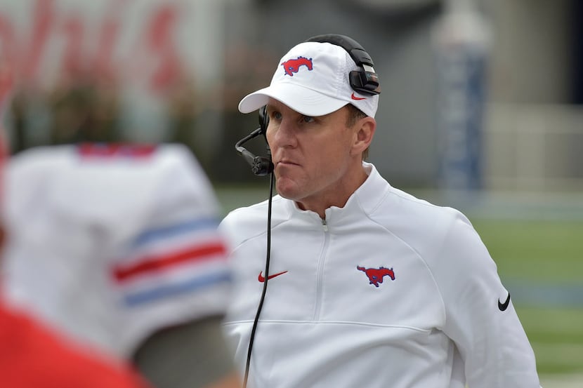 FILE - In this Nov. 18, 2017, file photo, SMU head coach Chad Morris watches from the...