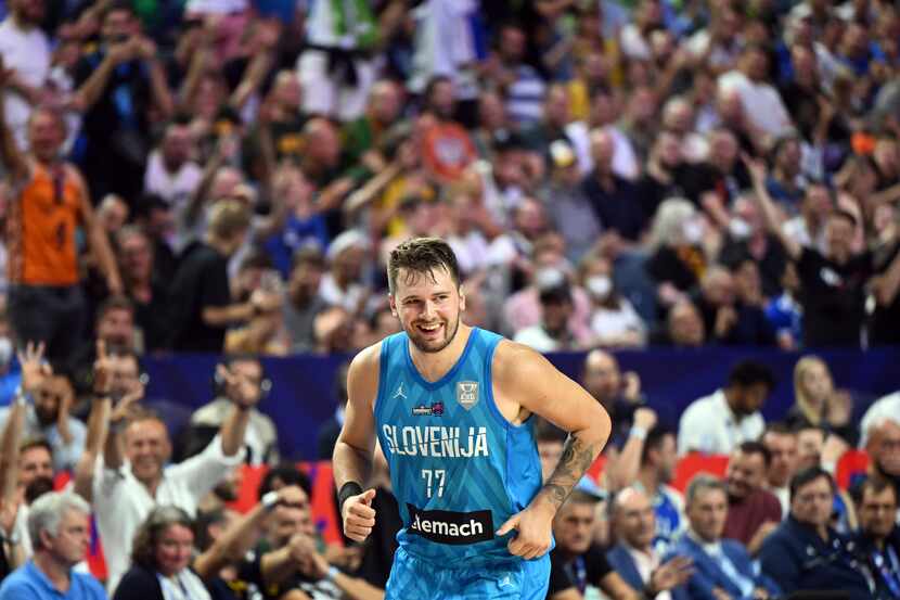 Slovenia's Luka Doncic celebrates a basket against France during their Eurobasket group B...