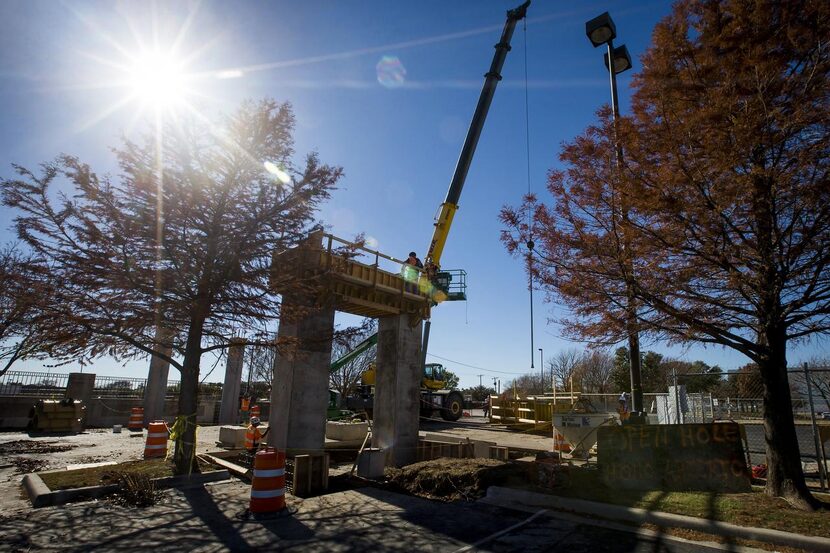 
Construction has begun on a pedestrian bridge that will span East Abram Street at the...