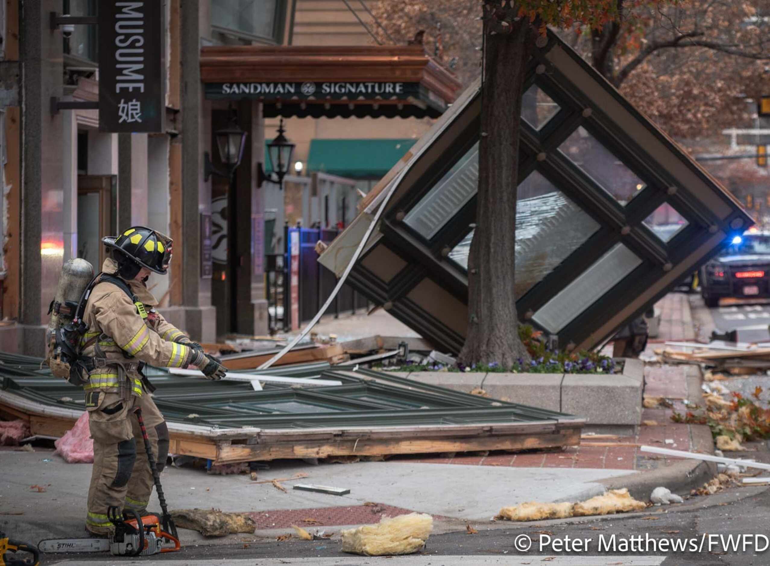 Fort Worth firefighters respond to an explosion at the Sandman Signature Hotel building in...