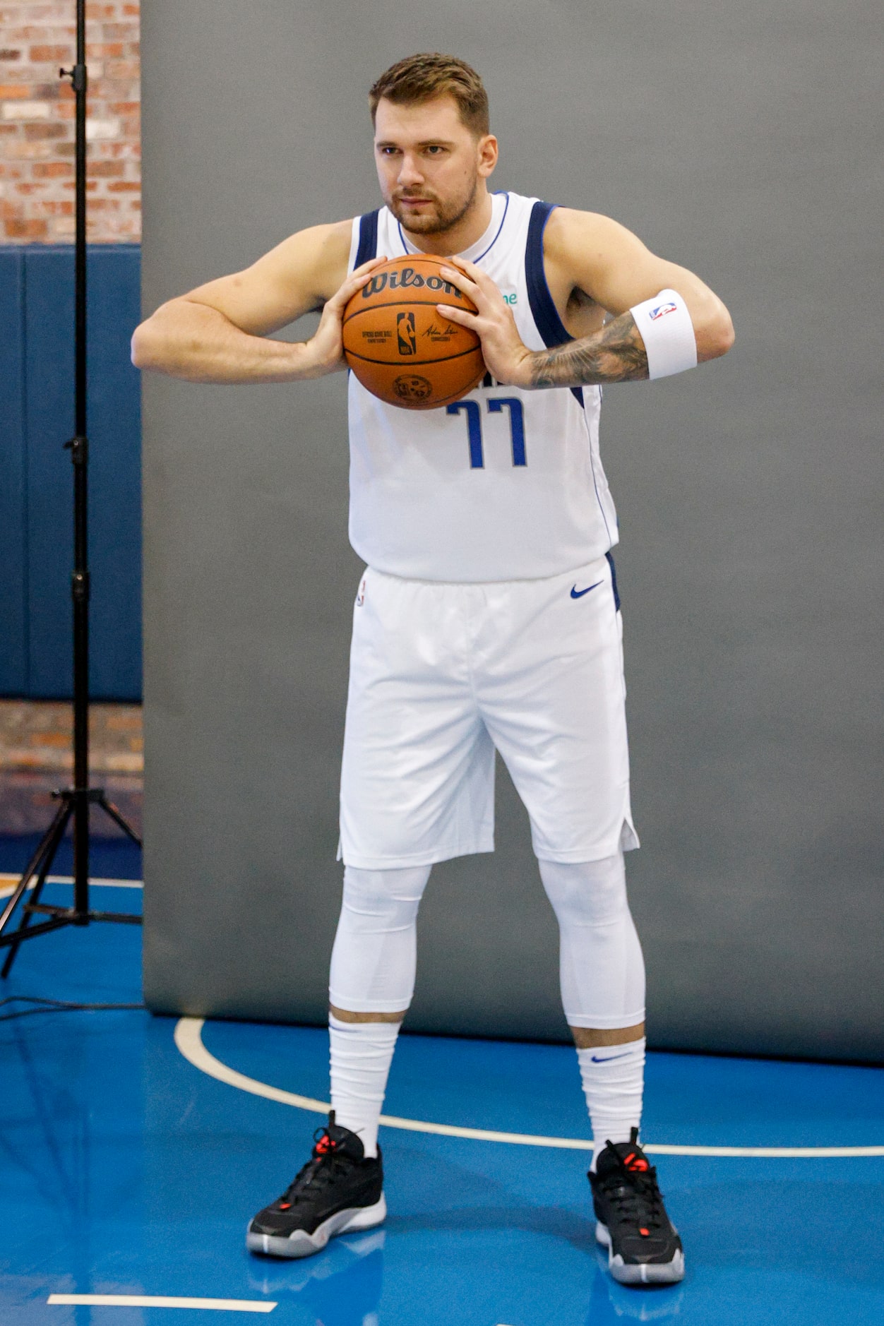 Dallas Mavericks guard Luka Doncic (77) poses for a picture during media day at American...