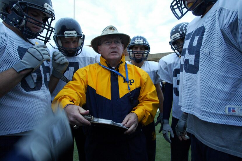 FILE: Highland Park head football coach Randy Allen (center) talks to players during a...