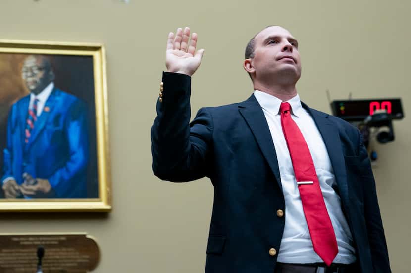 U.S. Air Force (Ret.) Maj. David Grusch is sworn in before a House Oversight and...