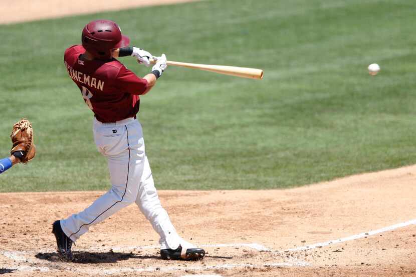Frisco RoughRiders left fielder Scott Heineman (8) hits the ball during the first inning of...