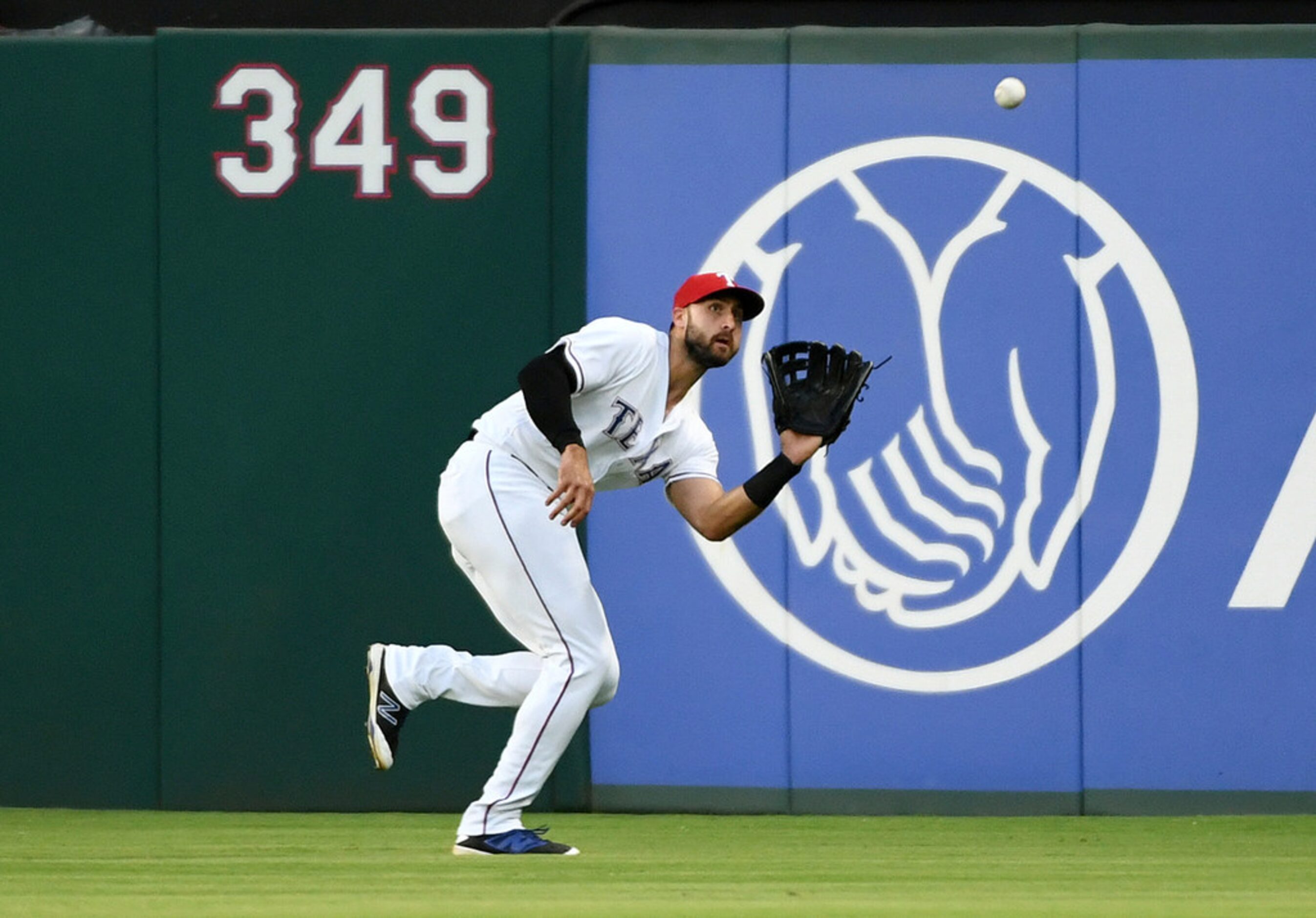 Texas Rangers right fielder Joey Gallo makes the catch on a line drive by Oakland Athletics'...