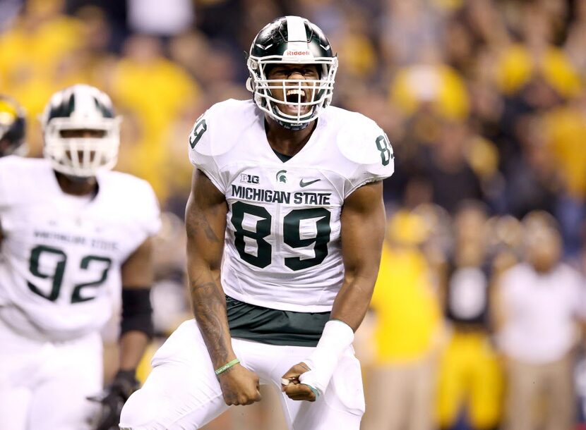 INDIANAPOLIS, IN - DECEMBER 05:  Shilique Calhoun #89 of the Michigan State Spartans...