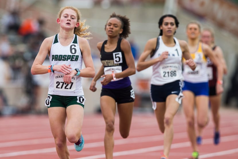 Prosper's Aubrey O'Connell (left) crosses the finish line first in the High School Girls...