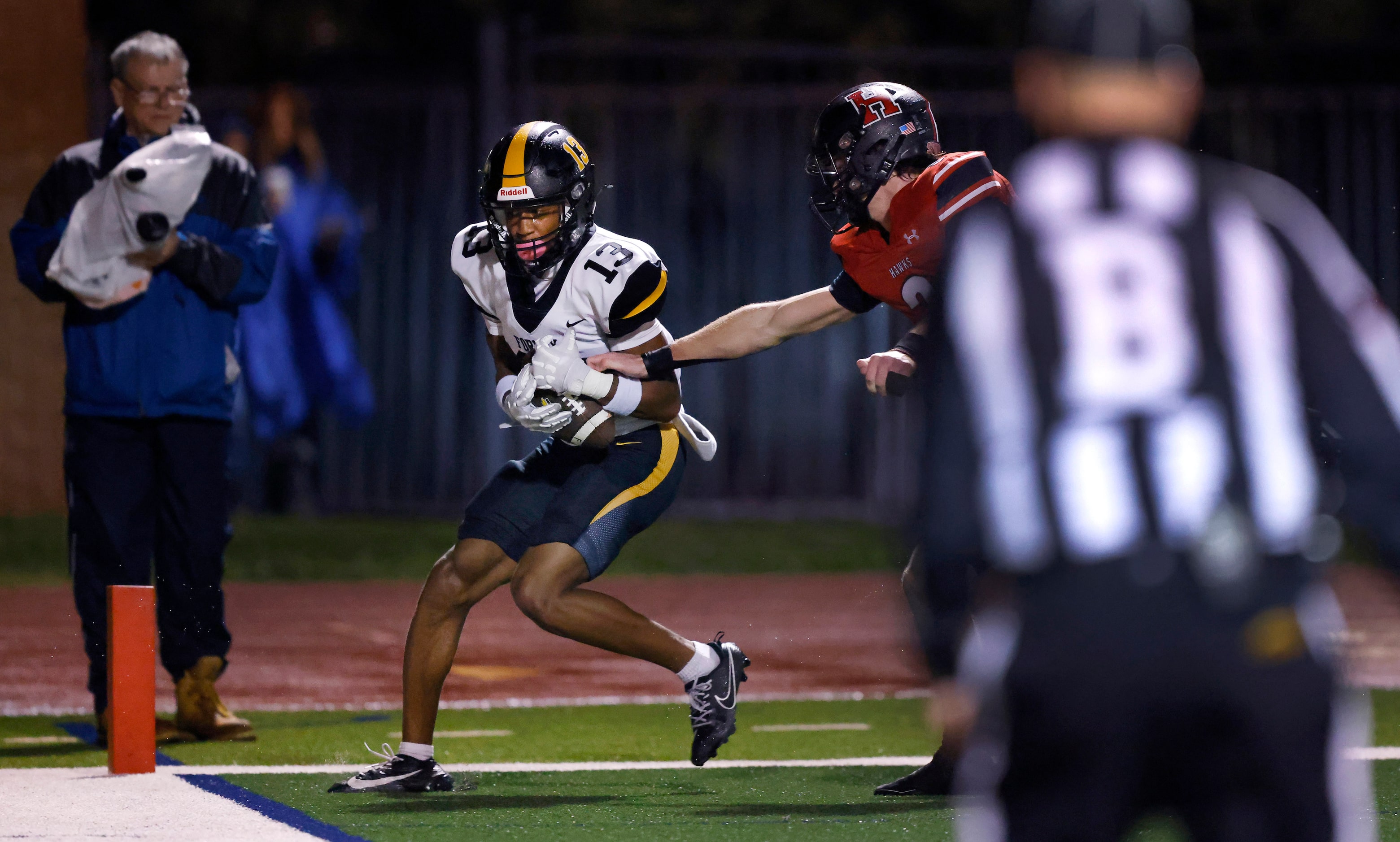 Forney wide receiver Preston Jackson (13) caches a would-be touchdown ahead of ...