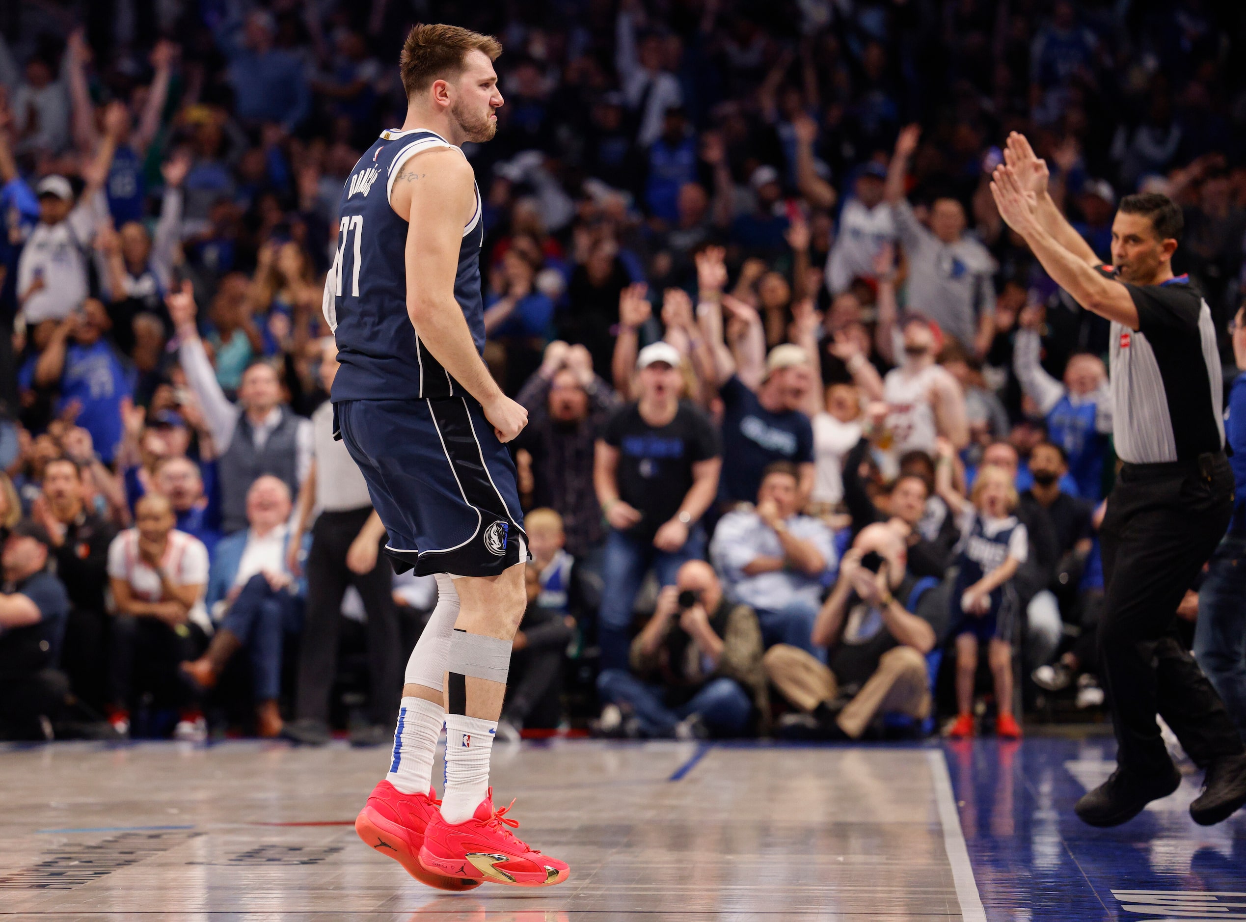 Dallas Mavericks guard Luka Doncic (77) reacts after making a three-pointer during the...