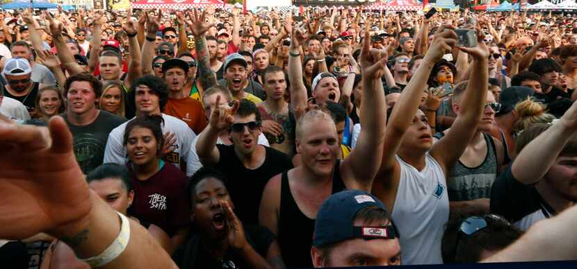 The audience screams during Vans Warped Tour at Gexa Energy Pavilion in Dallas Saturday,...