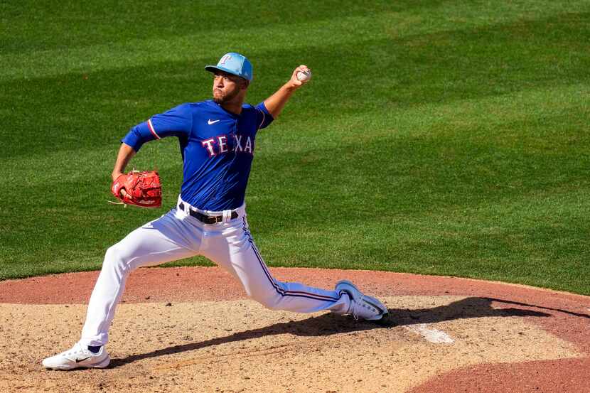 Texas Rangers pitcher Antoine Kelly delivers during the seventh inning of a spring training...
