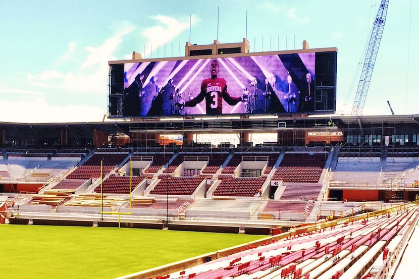 Former Oklahoma wide receiver Sterling Shepard appears on OU's new video board during...