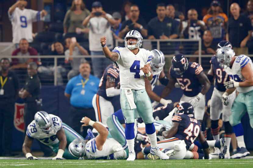 Dallas Cowboys quarterback Dak Prescott (4) celebrates after Dallas Cowboys running back...