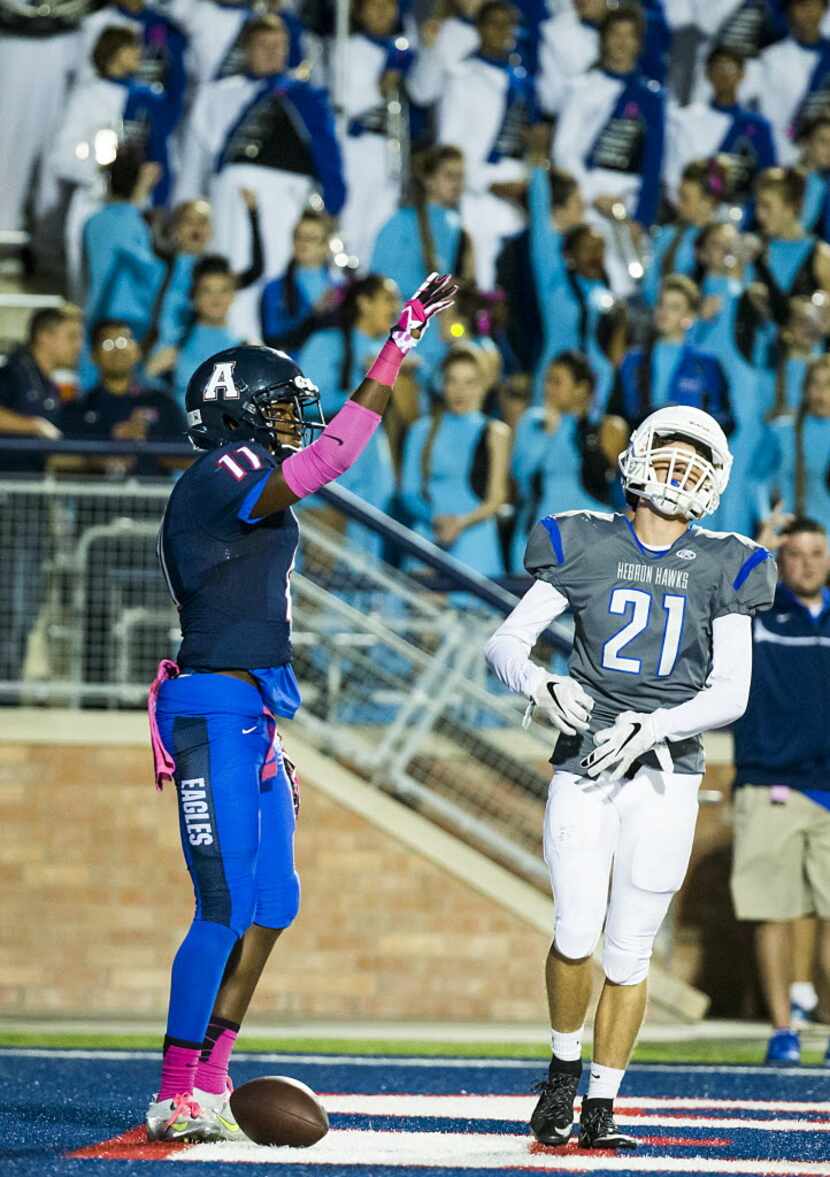 Allen wide receiver Lionell McConnell (11) celebrates after catching a 42-yard touchdown...