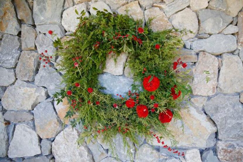 
Red zinnias, gomphrena, wild rose hips and possum-haw berries add holiday color.
