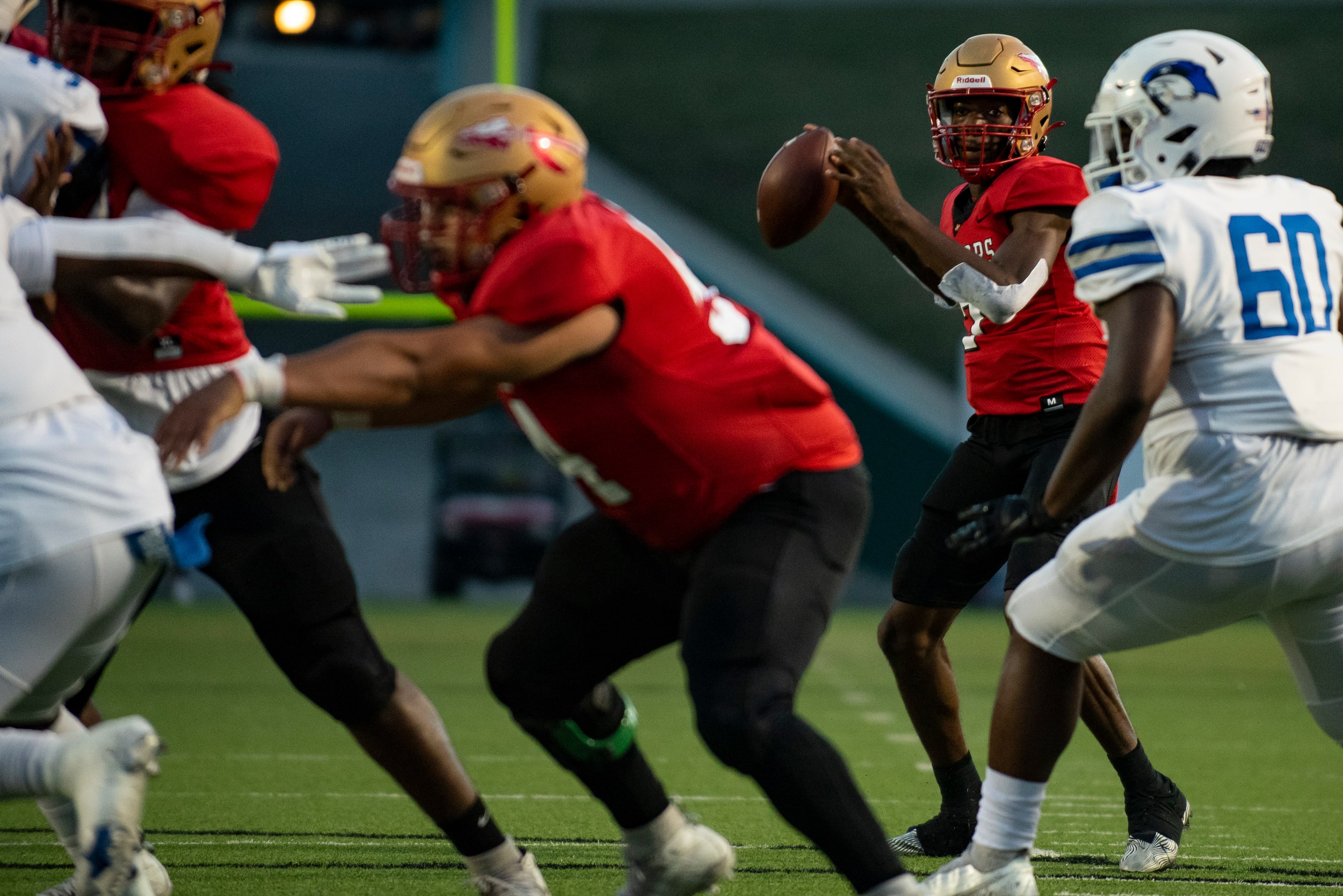 South Grand Prairie senior Michael Stallworth (7) looks for an open receiver during South...