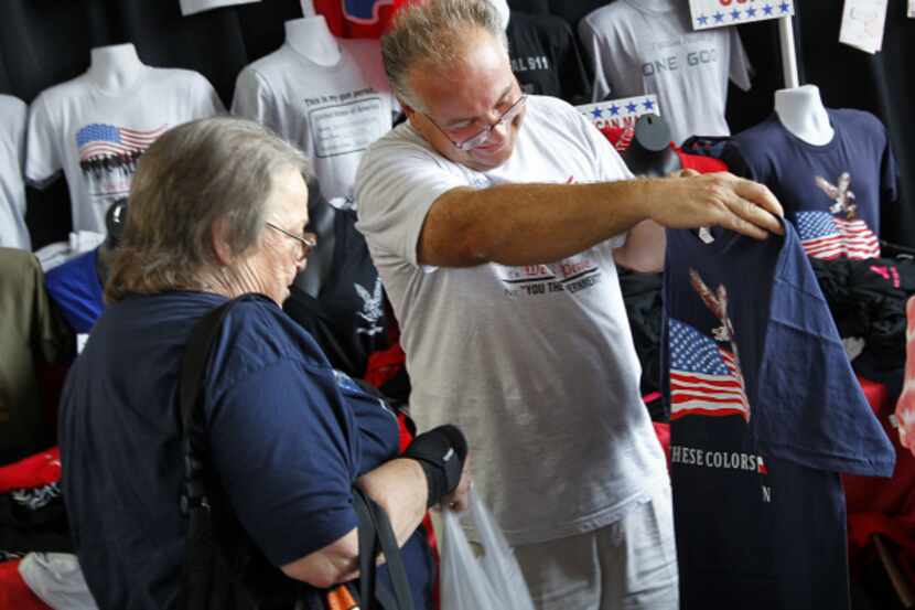 Vendor Ron Krohn showed American-made T-shirts to Loella Weeks of Tulsa, Okla., at Glenn...