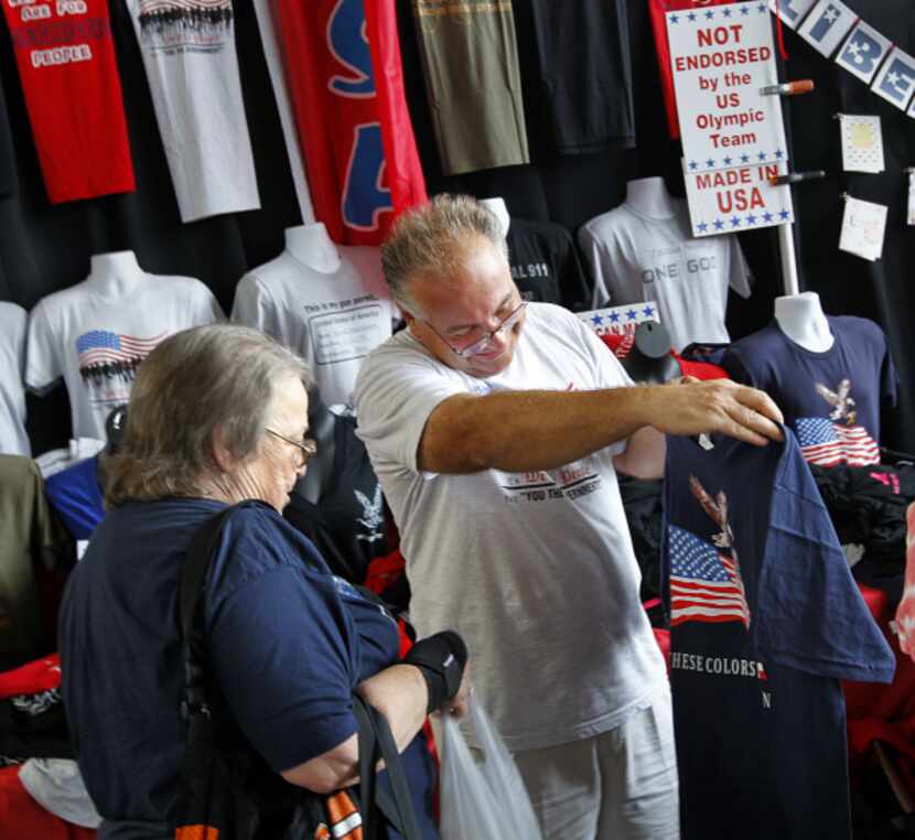 Vendor Ron Krohn showed American-made T-shirts to Loella Weeks of Tulsa, Okla., at Glenn...