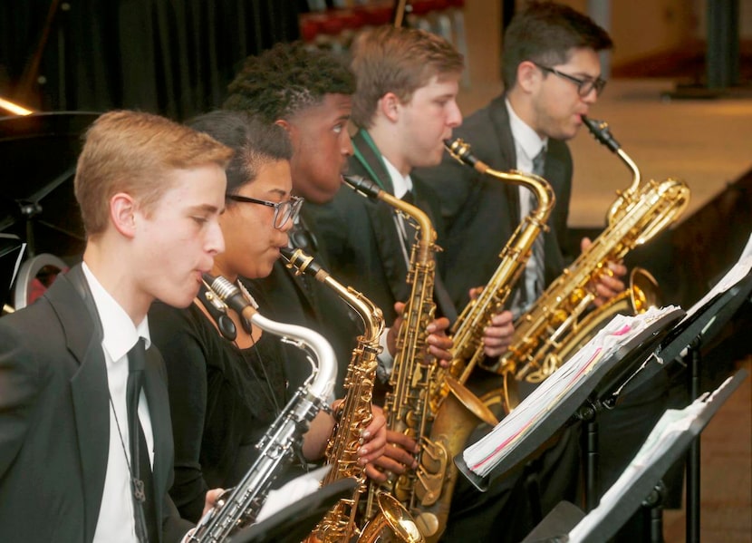 
Saxophone players Ross Gerberich (from left), Camille Dario, Patrick Hill, Brandon Ward and...