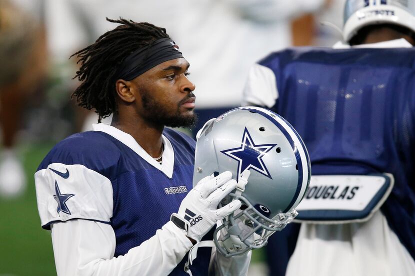 Dallas Cowboys cornerback Trevon Diggs (31) prepares to put his helmet on for the next play...