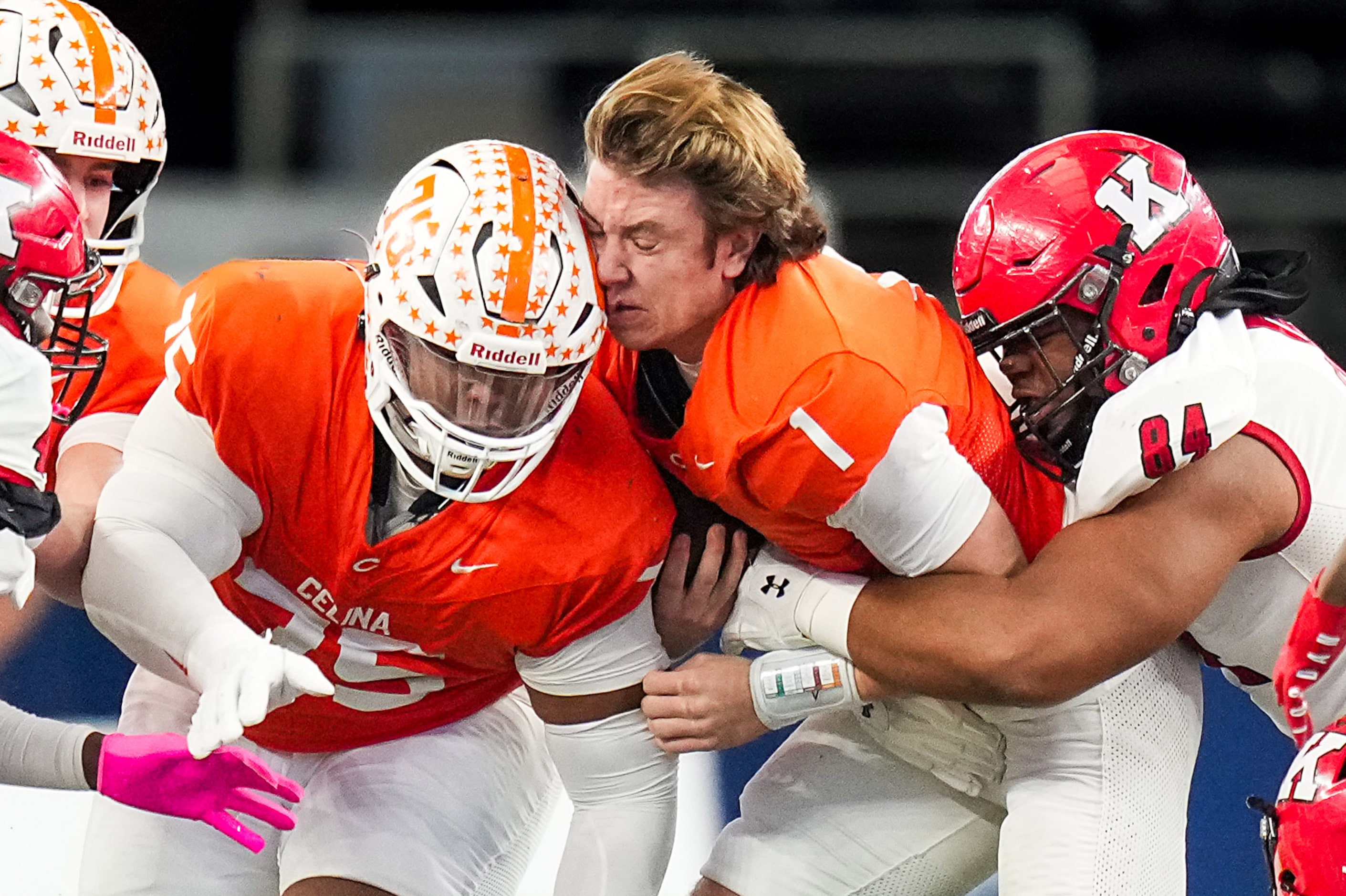 Celina's Bowe Bentley (1) is brought down by Kilgore's Eli Young (84) after having his...