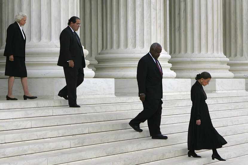 
A file photo shows justices Sandra Day O'Connor, Antonin Scalia, Clarence Thomas and Ruth...