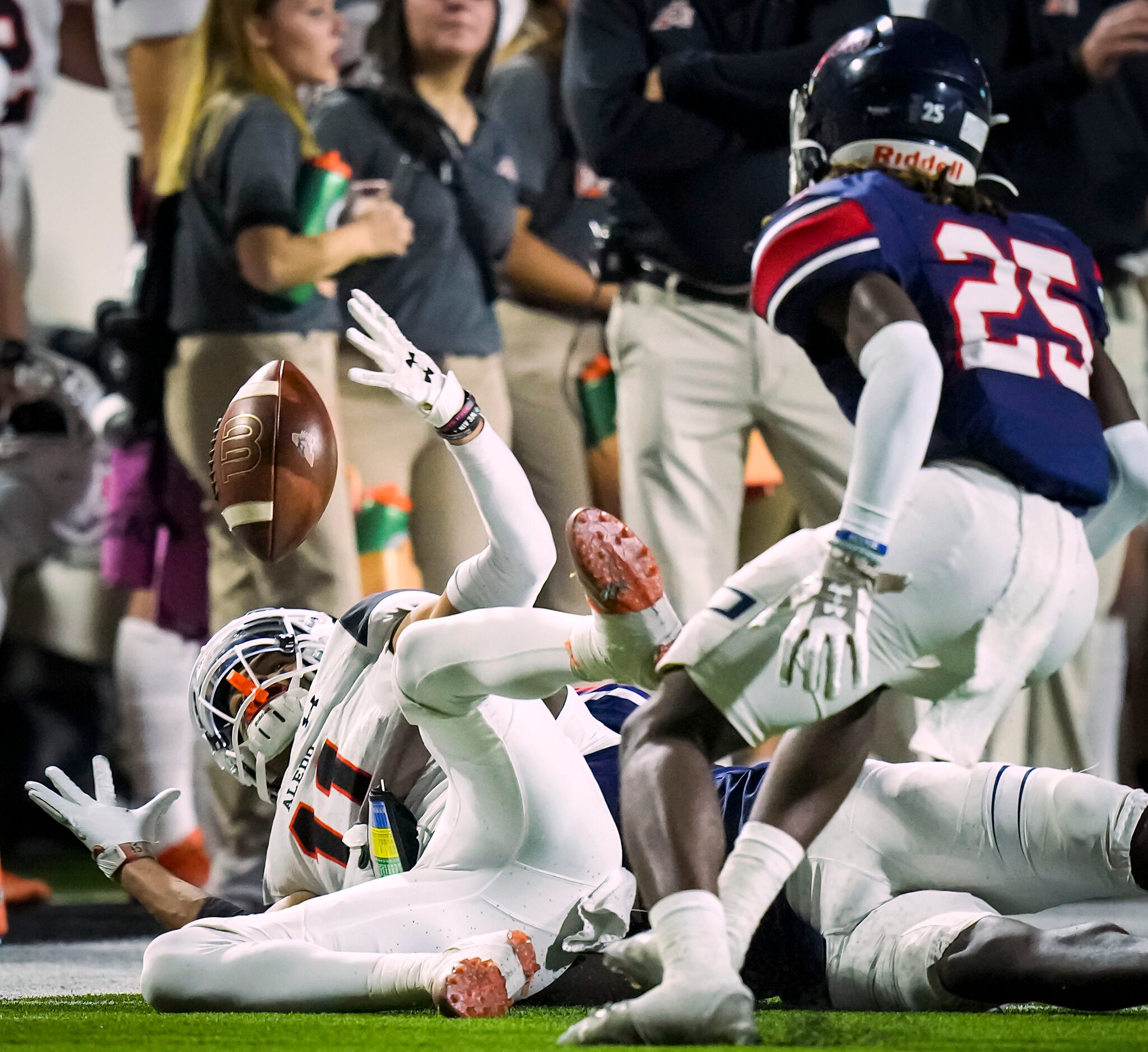 Aledo wide receiver Jalen Pope (11) grabs the ball as he hits the turf to make a catch...