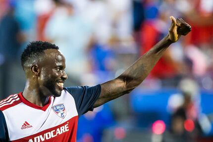FC Dallas forward Roland Lamah gives a thumbs up to the crowd as he leaves the field after a...