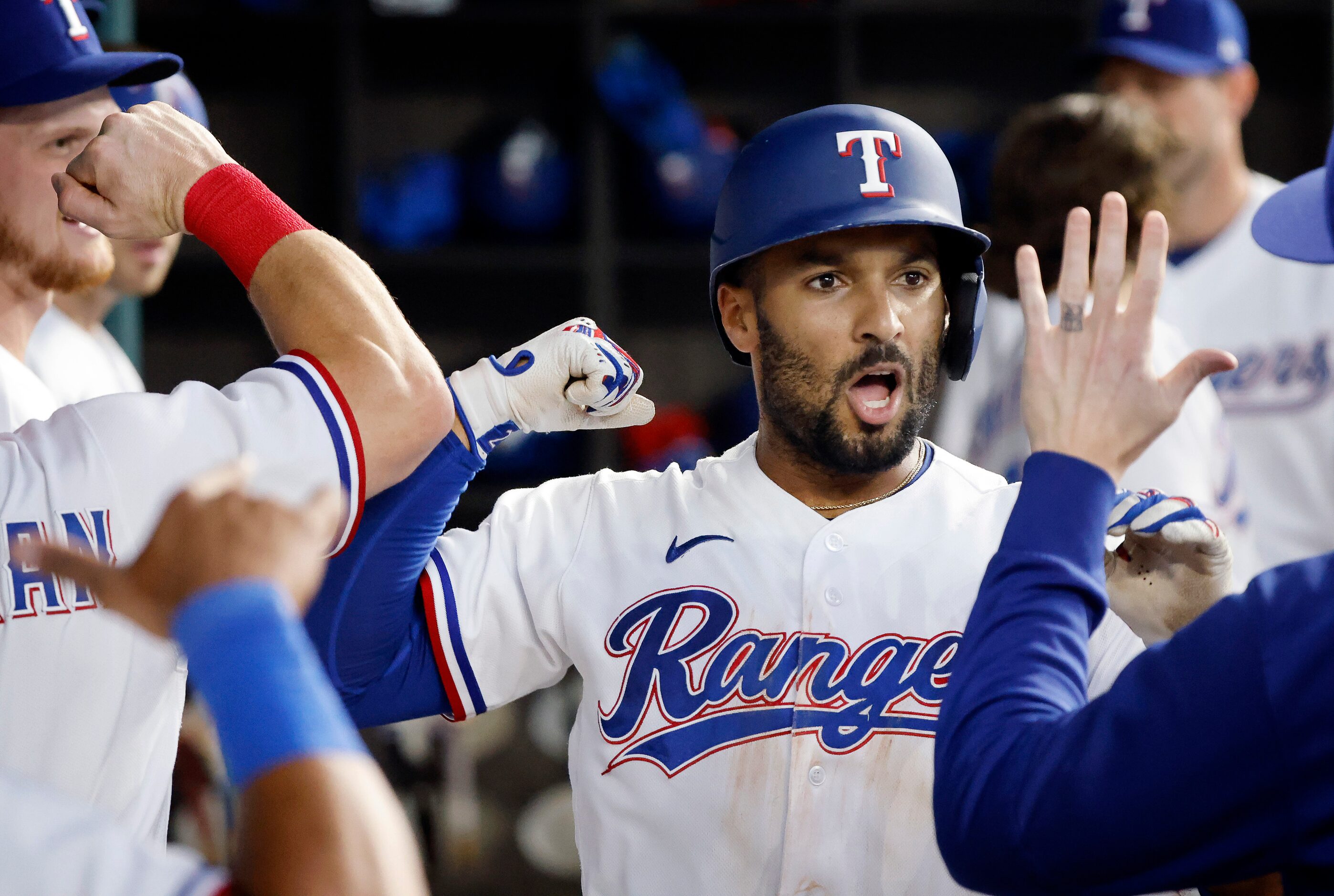 Texas Rangers second baseman Marcus Semien (2) is fired up after hitting a solo home run,...