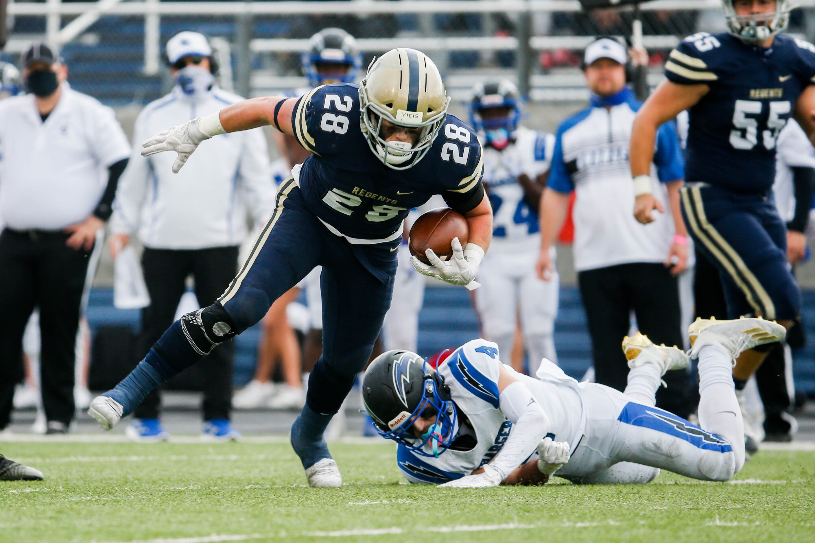 Austin Regents's Trevor Tezak (28) dodges Dallas Christian's Andrew Baucum (4) during the...