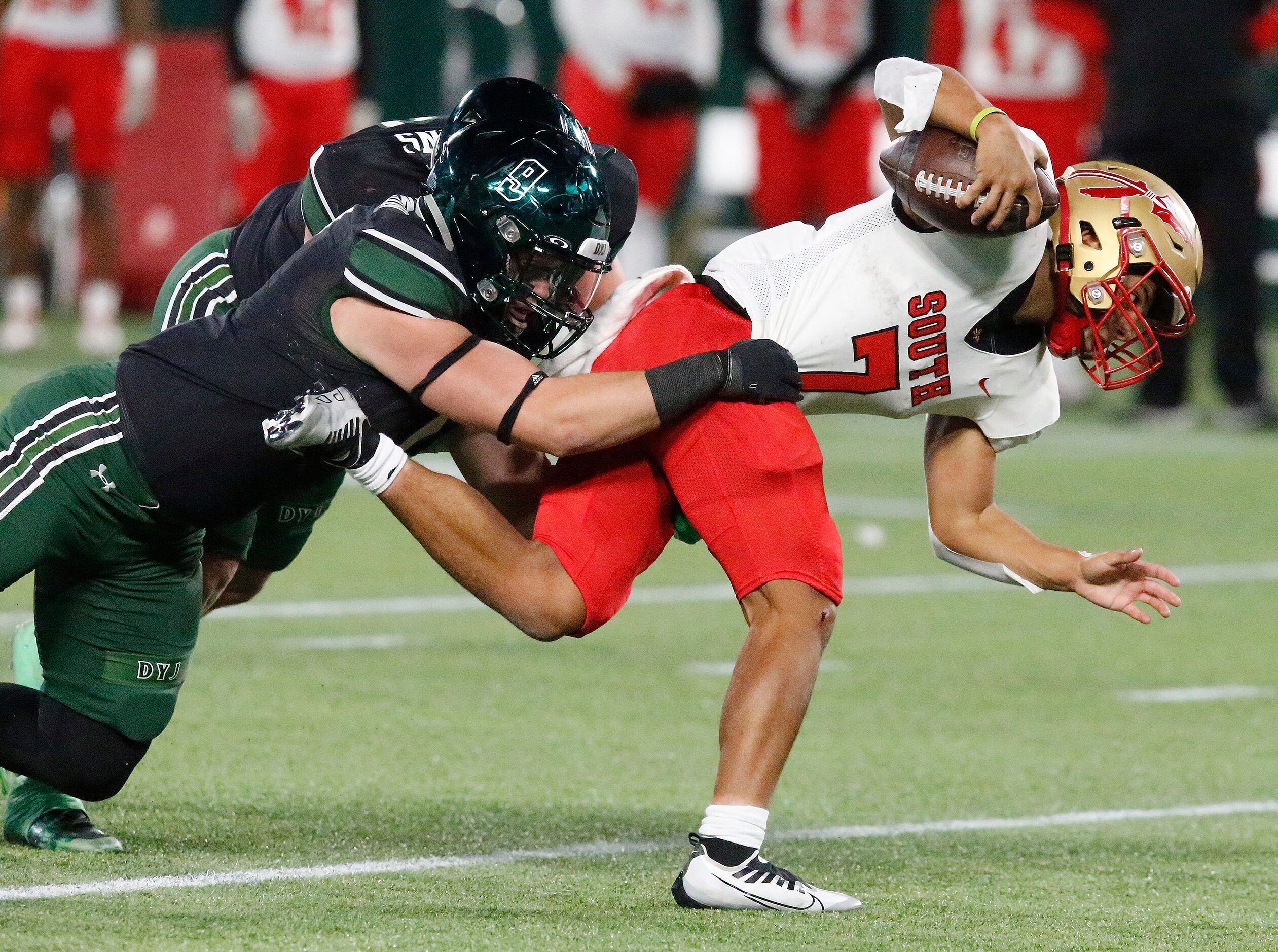 South Grand Prairie High School quarterback Jaden Stanley (7) is caught by Prosper High...