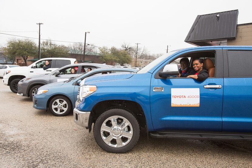Toyota employees in a blue truck volunteering with Collin County Meals on Wheels