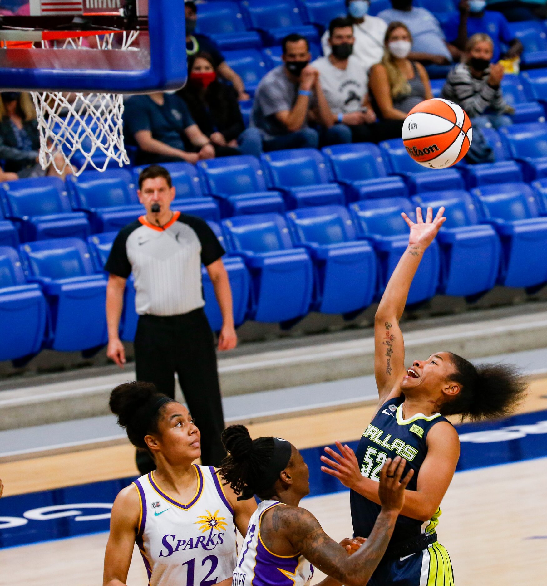 Dallas Wings guard Tyasha Harris (52) goes for a shot in the second quarter against the Los...