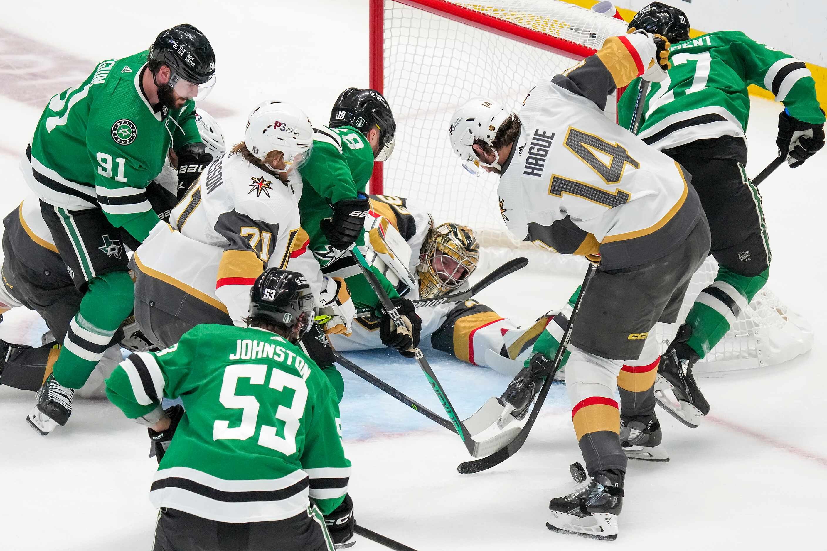 Vegas Golden Knights goaltender Adin Hill (33) makes a sprawling save in front of Dallas...