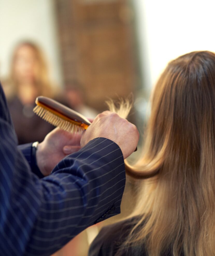 Tara Tonini having her hair brushed out by Henry.