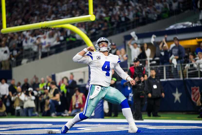 Dallas Cowboys quarterback Dak Prescott (4) celebrates what he thought was a touchdown...