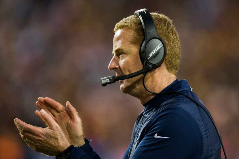 Dallas Cowboys head coach Jason Garrett claps on the sideline during the fourth quarter of...