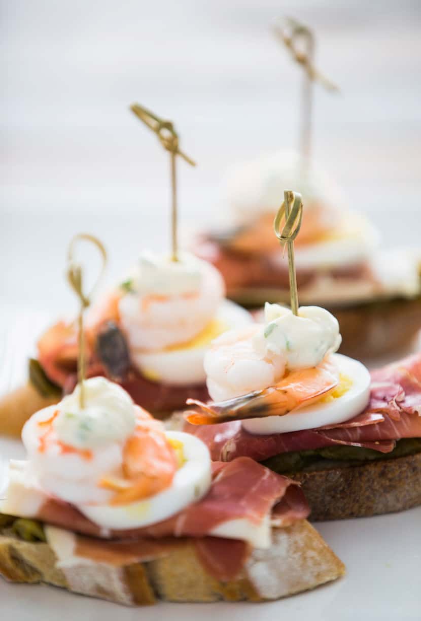 Jamon serrano with roasted peppers, egg and shrimp