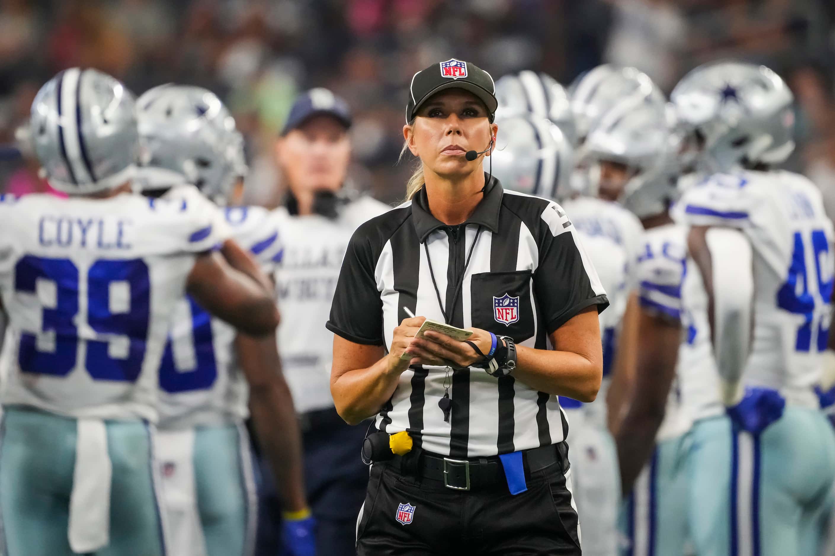 Down judge Sarah Thomas takes notes during a timeout in the second half of a preseason NFL...