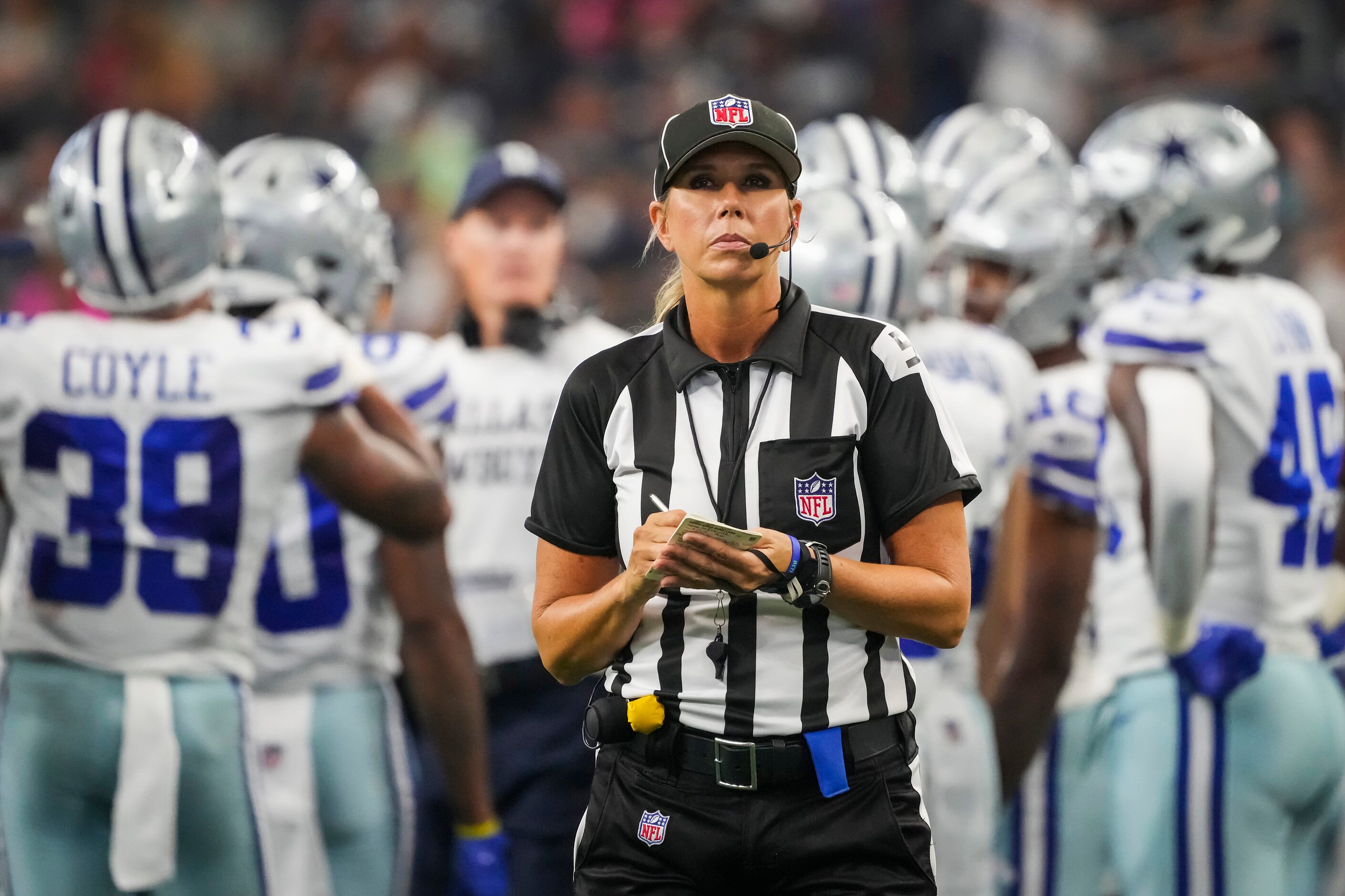 Down judge Sarah Thomas takes notes during a timeout in the second half of a preseason NFL...