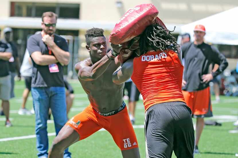 David Njoku drills with Standish Dobard during the University of Miami annual NFL football...