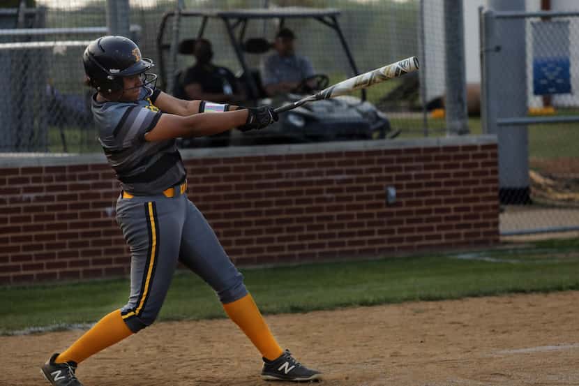 Vanessa Hollingsworth swings for the ball during a softball game between Forney at North...