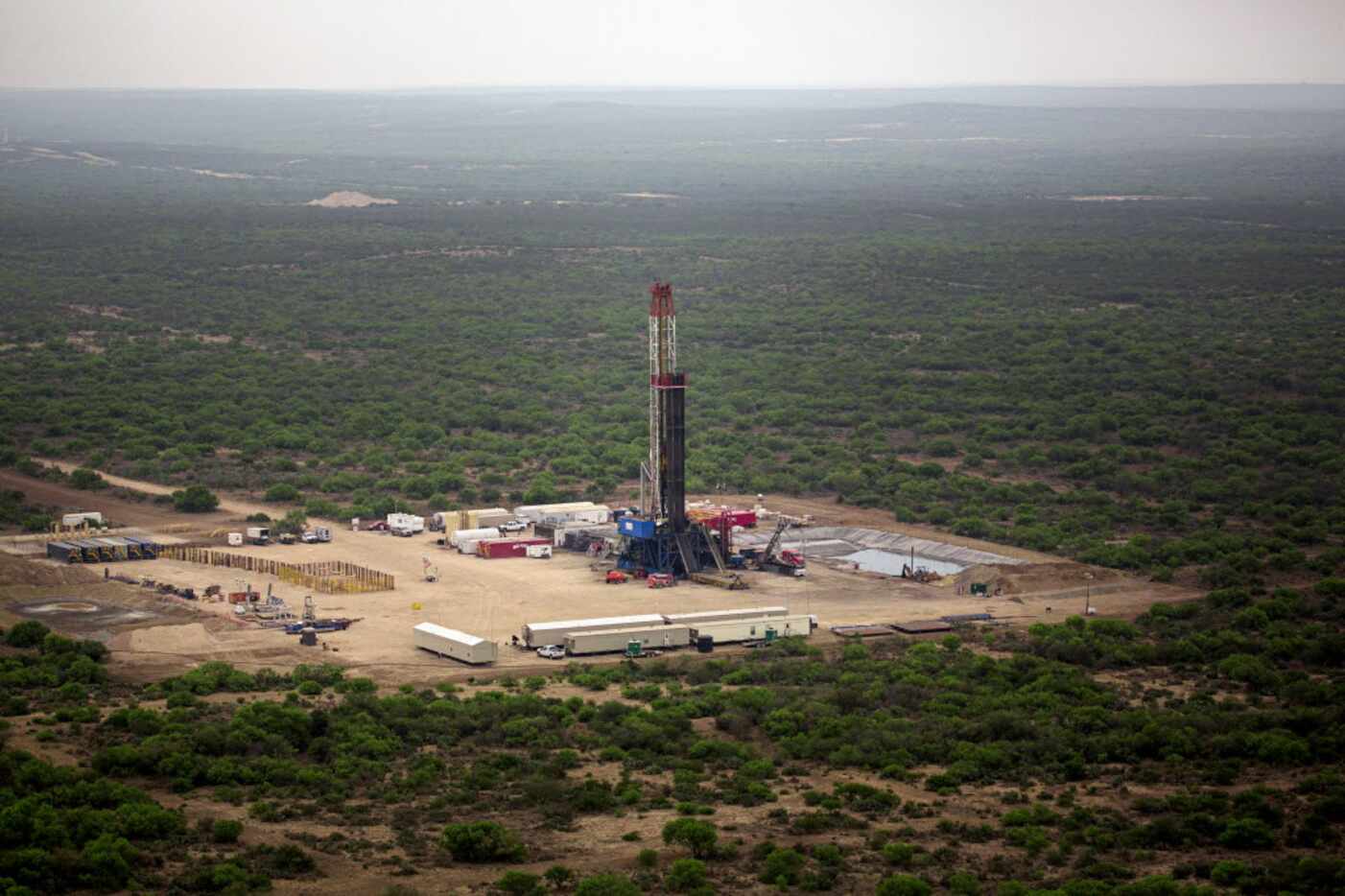 A natural gas drilling site stands in the middle of Webb County in this aerial image from...