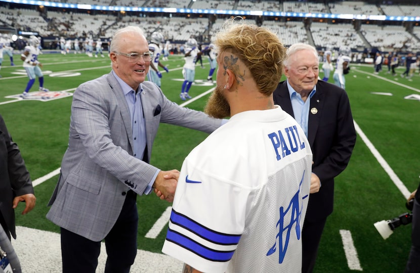 Boxer Jake Paul is greeted by Dallas Cowboys Stephen Jones before the Cowboys faced the New...